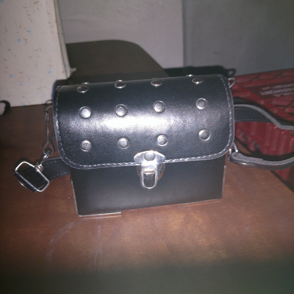 Purse 4. 5 in. Ht 5 in. Width 2 inch bottom L